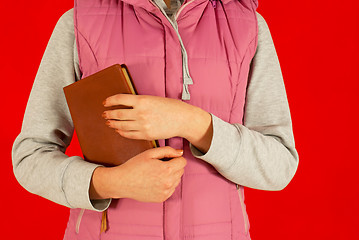 Image showing Female staying with a book