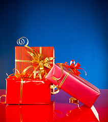 Image showing Christmas presents against blue background