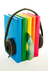 Image showing Row of books and headphones - Audiobooks concept