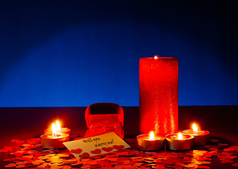 Image showing Two rings and a card with marriage proposal with six candles