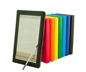 Image showing E-book reader with stack of printed books