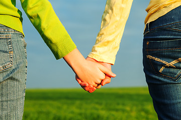 Image showing Teen girls holding hands