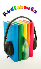 Image showing Row of books and headphones - Audiobooks concept