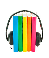 Image showing Row of books and headphones - Audiobooks concept