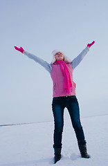 Image showing Teen girl staying with raised hands