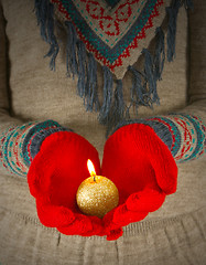 Image showing Human hands hold burning  golden candle