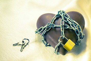 Image showing Heart shaped chocolate tied up with chains