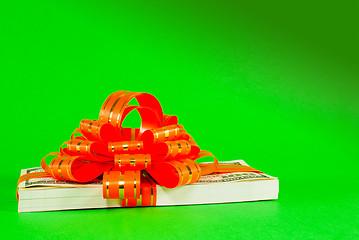 Image showing Stack of US 100 dollar bills tied up with a ribbon