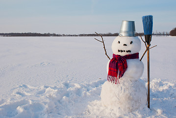 Image showing Lonely snowman at a snowy field