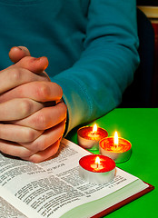 Image showing Female's arms over the Book of Psalms