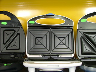 Image showing new toasters in a row