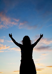 Image showing Woman staying with raised hands