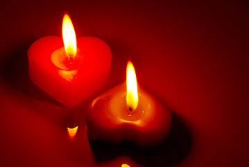 Image showing Two burning heart shaped candles