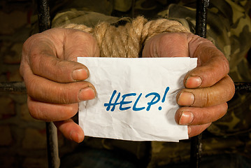 Image showing Man with hands tied up with rope