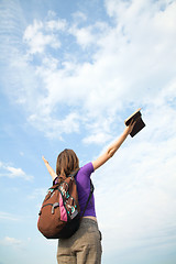 Image showing Teenage girl staying with raised hands