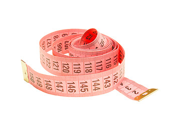 Image showing Curled pink measuring tape