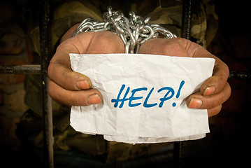 Image showing Man with hands tied with chain