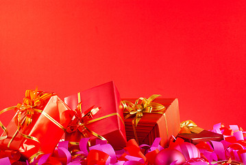 Image showing Christmas gifts over red background