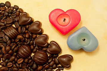 Image showing Two heart shaped candles and candies