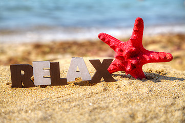 Image showing Wooden word 'Relax' with red starfish