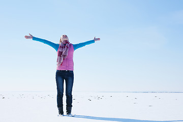 Image showing Teen girl staying with raised hands