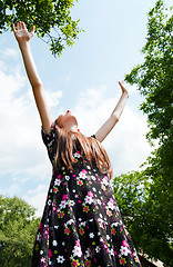Image showing Teen girl with raised hands