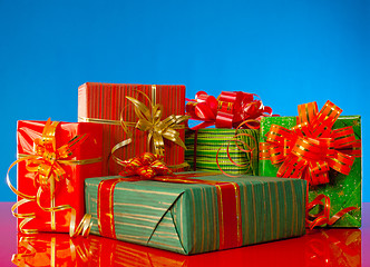 Image showing Christmas presents against blue background