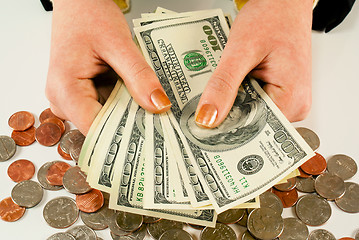 Image showing Female's hands with 100 US dollar bills