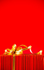 Image showing Wrapped box against red background