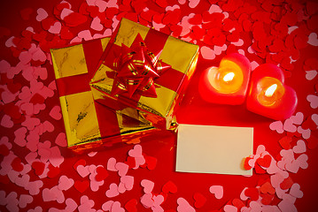 Image showing Presents and two heart shaped candles with blank card