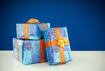 Image showing Christmas presents against blue background