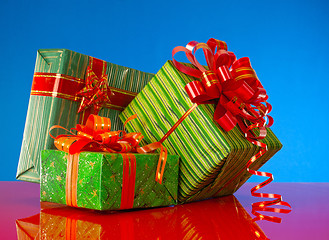 Image showing Christmas presents against blue background