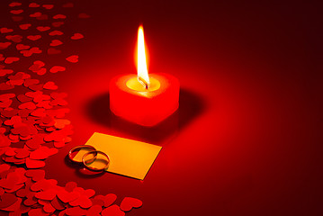 Image showing Two rings and a blank card with burning candle