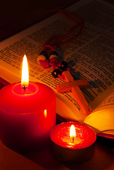 Image showing Open Bible with cross and burning candles