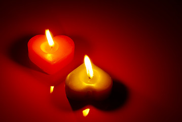 Image showing Two burning heart shaped candle