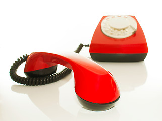 Image showing Red old fashioned telephone - Contact us concept