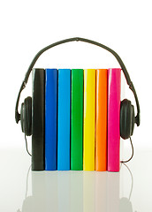 Image showing Row of books and headphones - Audiobooks concept