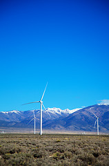 Image showing Power mills field in front of the mountain range