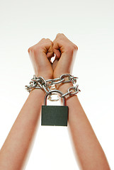 Image showing Hands tied up with chains