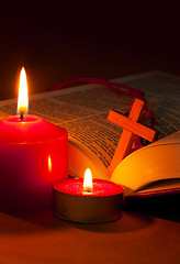 Image showing Open Bible with cross and burning candles