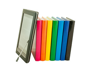 Image showing Stack of colorful books and electronic book reader