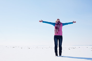 Image showing Teen girl staying with raised hands