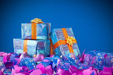 Image showing Christmas presents against blue background