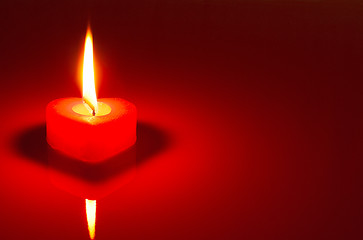Image showing Burning heart shaped candle