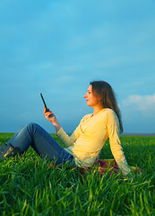 Image showing Teen girl reading electronic book