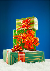 Image showing Christmas presents against blue background