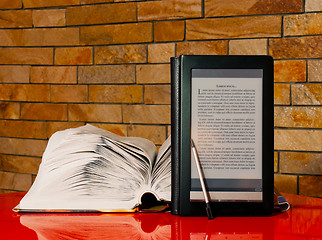 Image showing Open book and electronic book reader