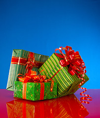 Image showing Christmas presents against blue background