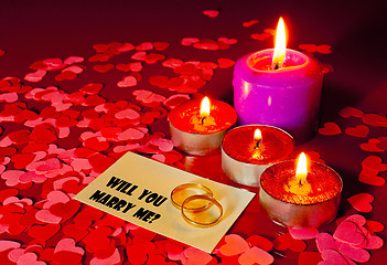 Image showing Two rings and a card with marriage proposal with four candles