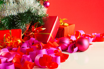 Image showing Christmas gifts over red background